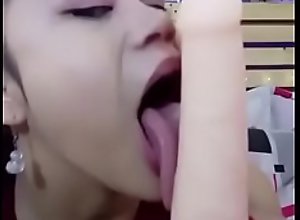 Sexy Asian with a long tongue