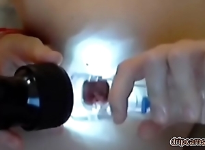Russian girl using anal speculum on webcam