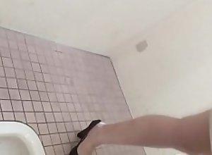 Asian whore squatting to piss