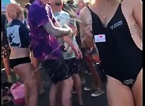 Mom squeezing her milk in crowd dance