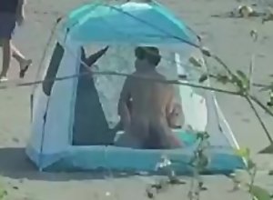 The couple make love in the tent