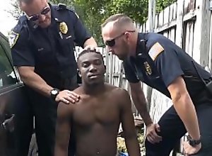 Two police officers take advantages of this black