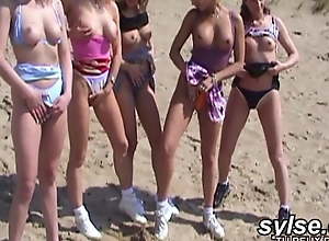 Lesbian teens and moms on beach