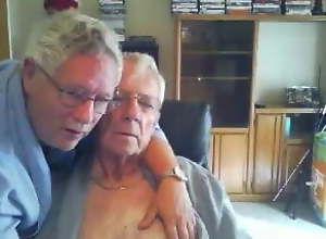 Two grandpas cuddling, kissing and loving - no