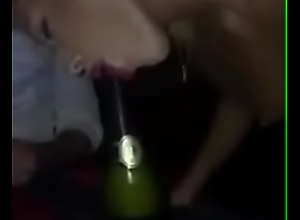 Girl sucks a bottle of champagne