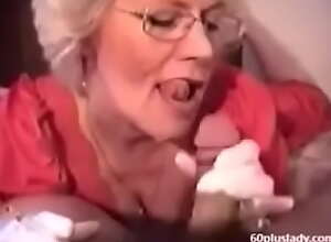 Very hot granny with glasses smoking while sucking