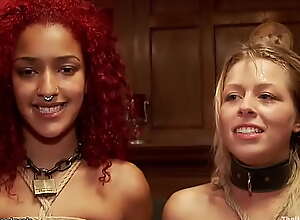 Ebony and blond slaves suck huge cock
