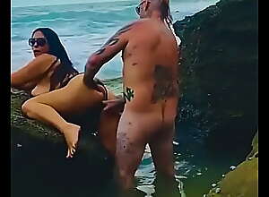 Tattooed Aussie couple fuck on public beach