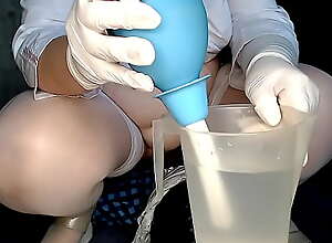Enema for the nurse's vagina over the patient's