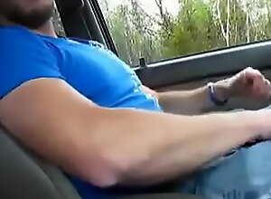 Guy strokes himself in the car while he waits for