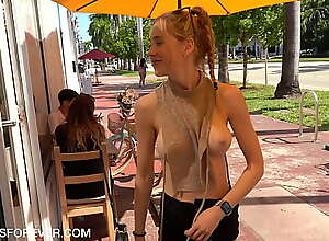Shan enjoys a coffee at hand her boobs exposed
