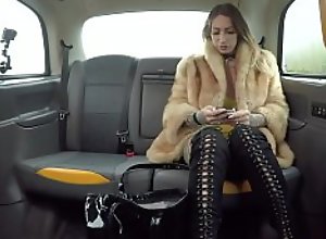 Fake Taxi Ava Austen rides a big black dildo on..